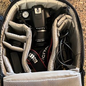 Canon rebel t1i dslr camera with backpack camera bag and battery charger